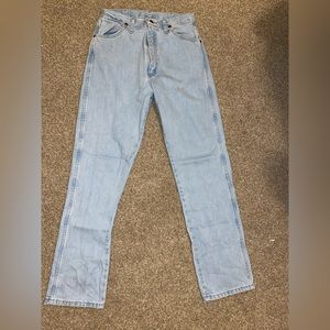 Light wash cowboy cut wrangler jeans. Size 11, 32 length